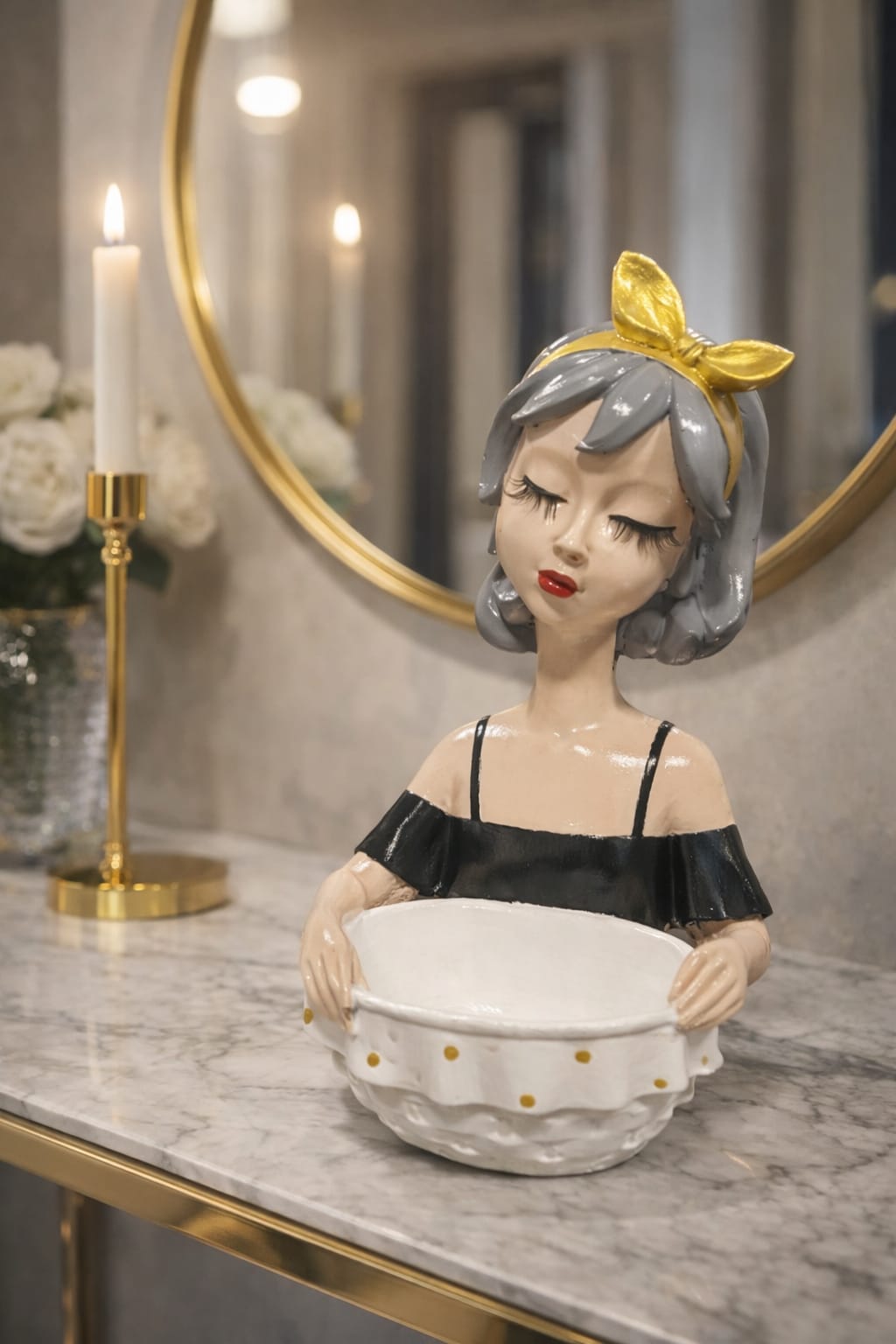Black figurine holding a white plate