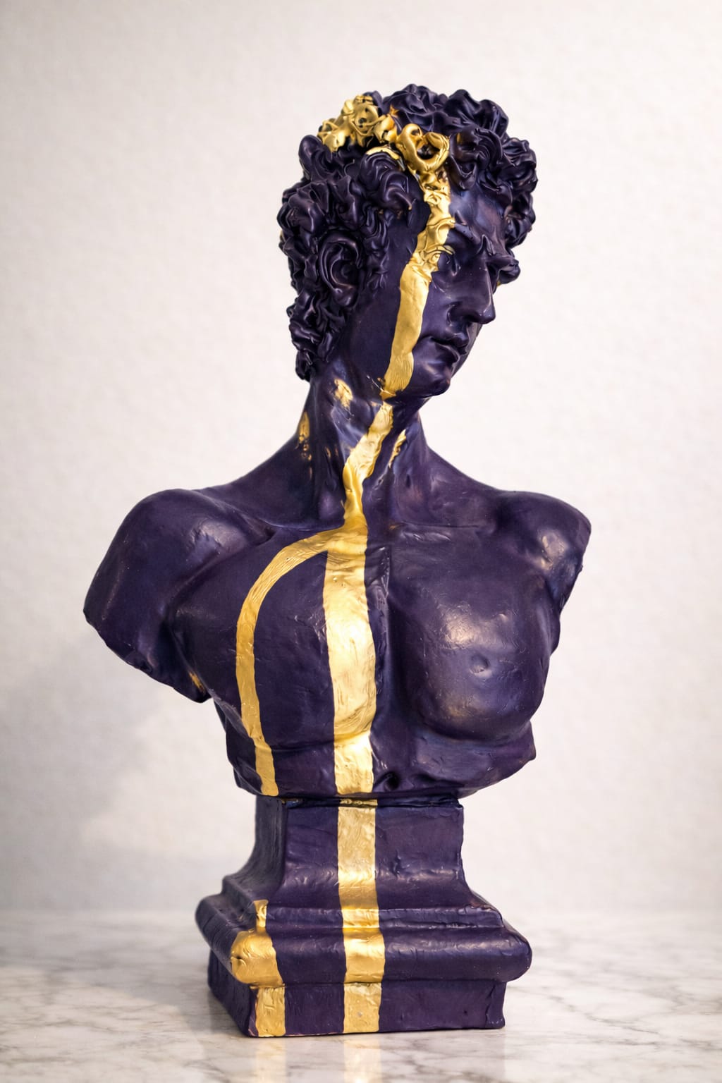 Modern luxury bust sculpture  with striking gold accents