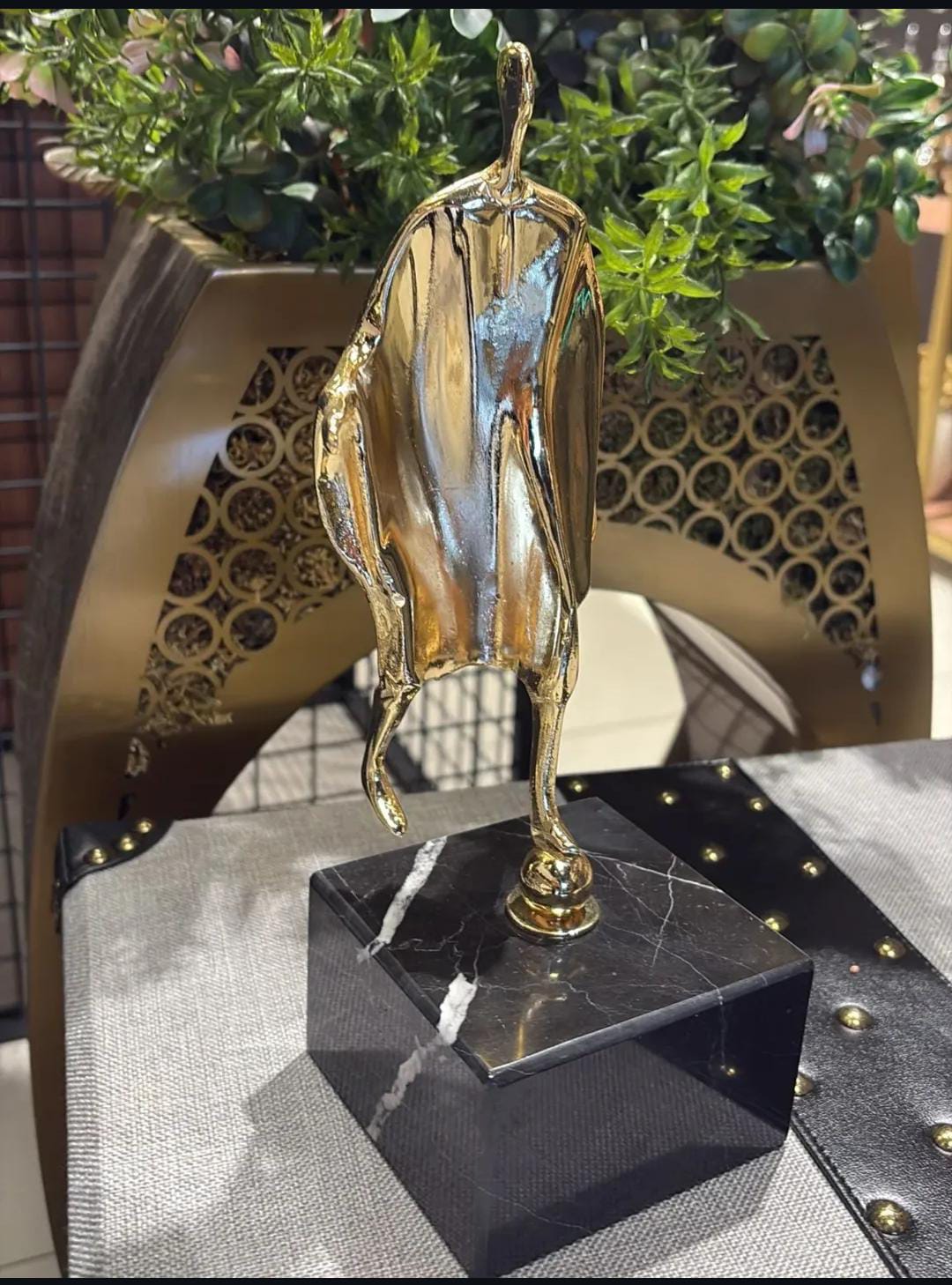 Man gold on black marble