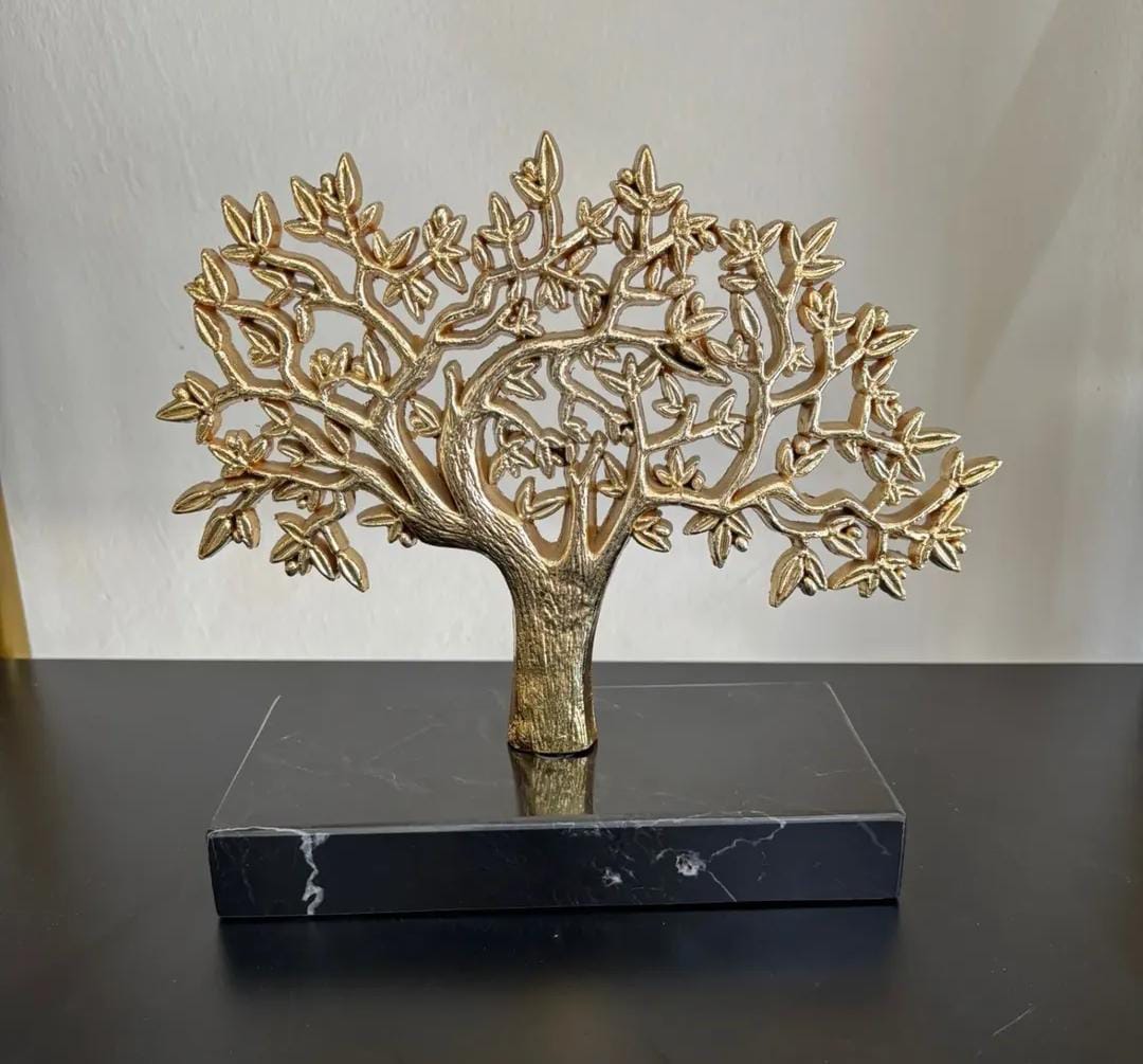 Gold tree with a black marble