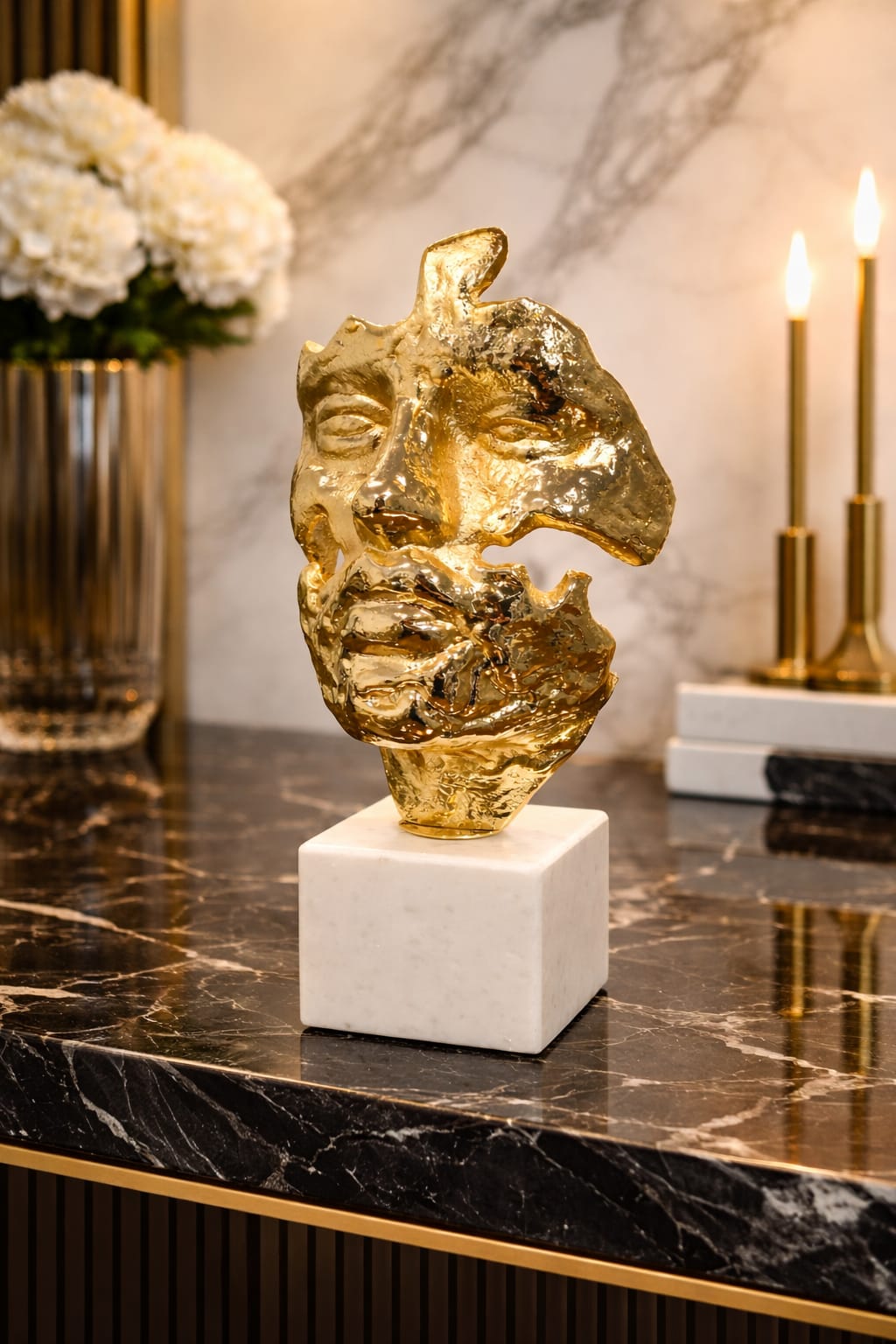 Golden face status with a white marble base