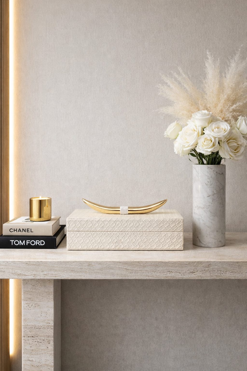 A decorative storage box, which features a textured ivory finish and a distinctive gold-tone horn-shaped handle - hover