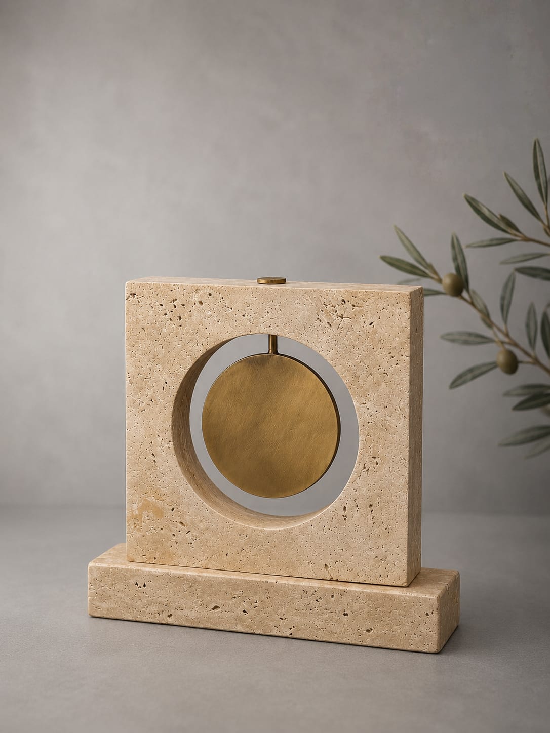 Travertine  decorative object with a brass circular detail