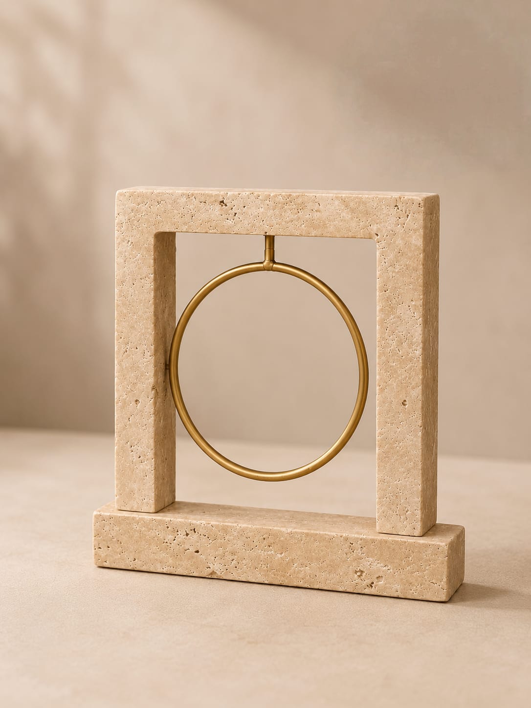 Decorative travertine and brass ring
