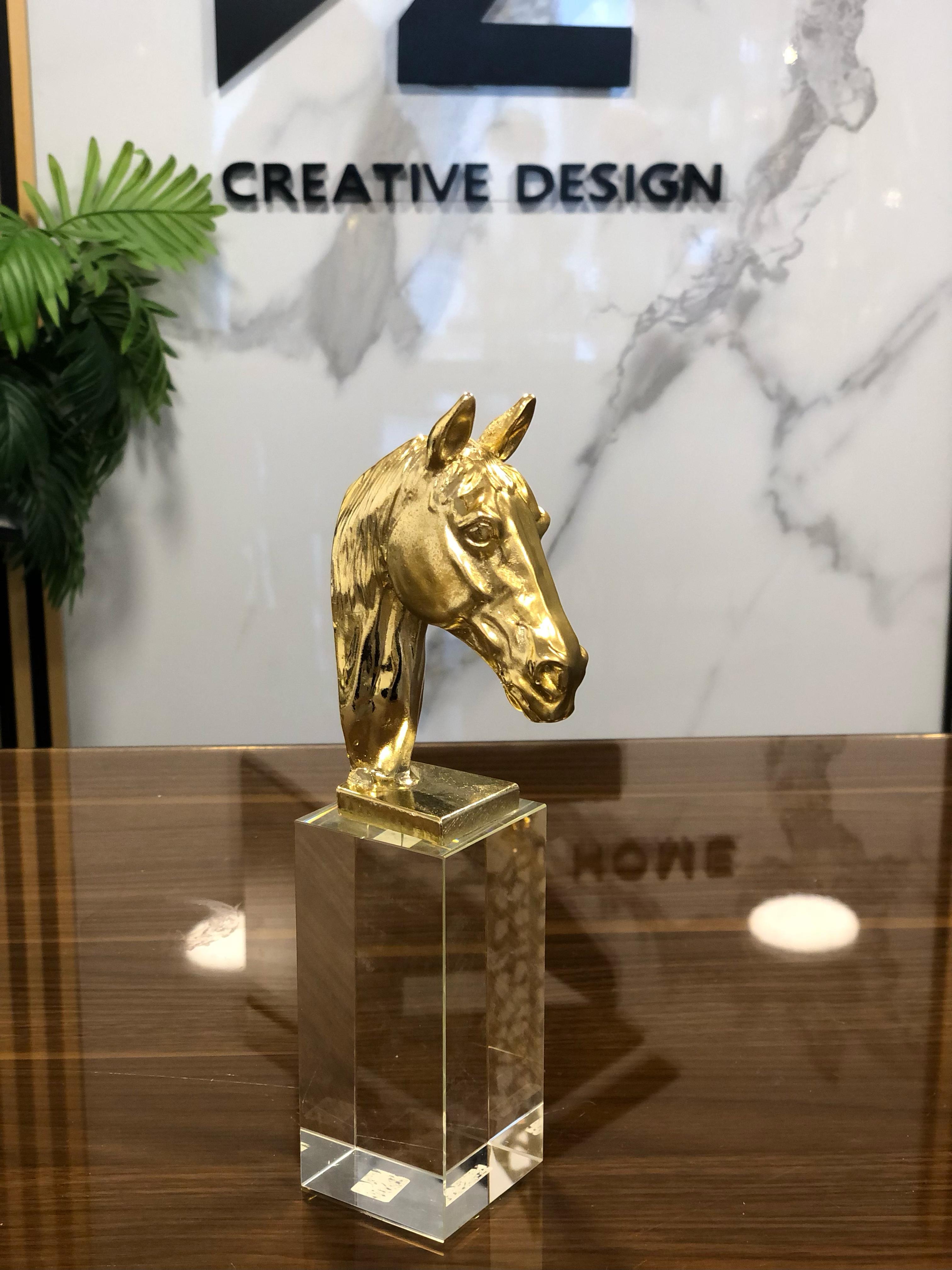 Gold horse with crystal base