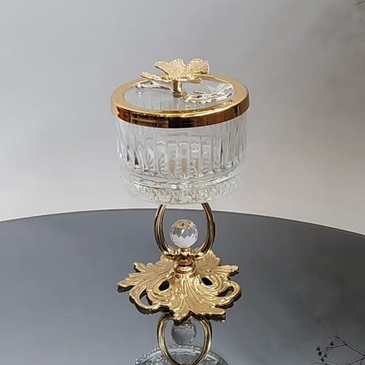 Glass bowl with lid and golden stand