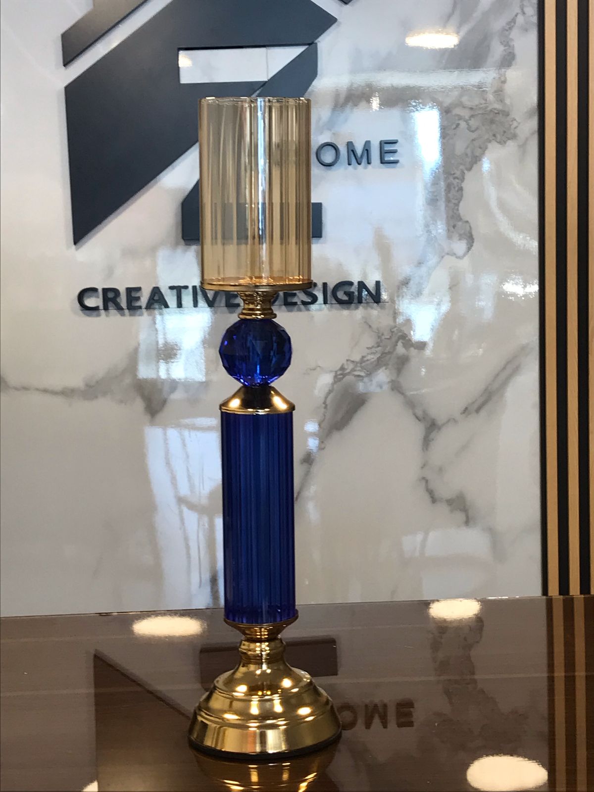 Golden candel holder with blue crystal Stand