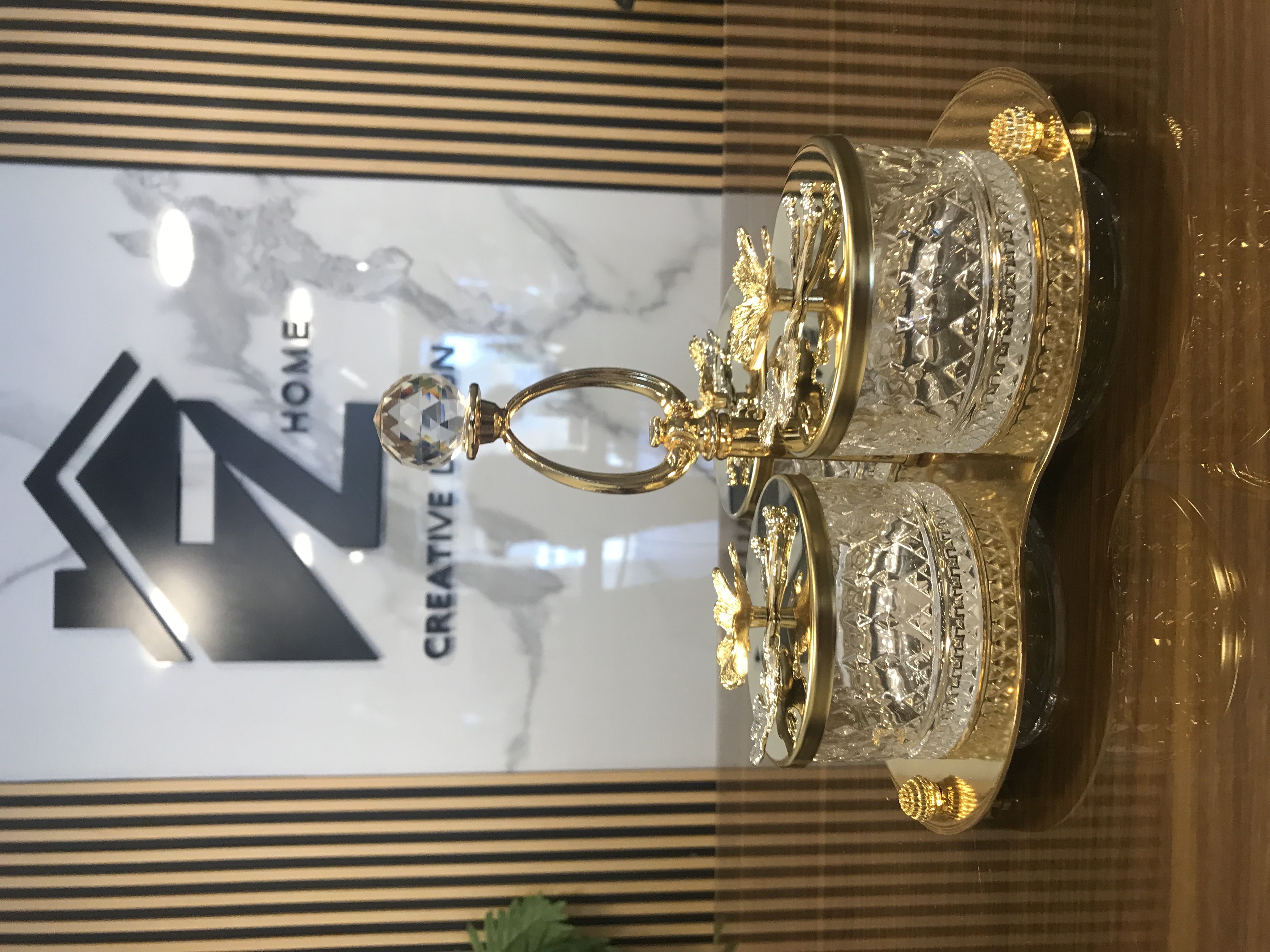 Luxury 3 crystal candy jars with golden lids and floral accents on a decorative gold tray
