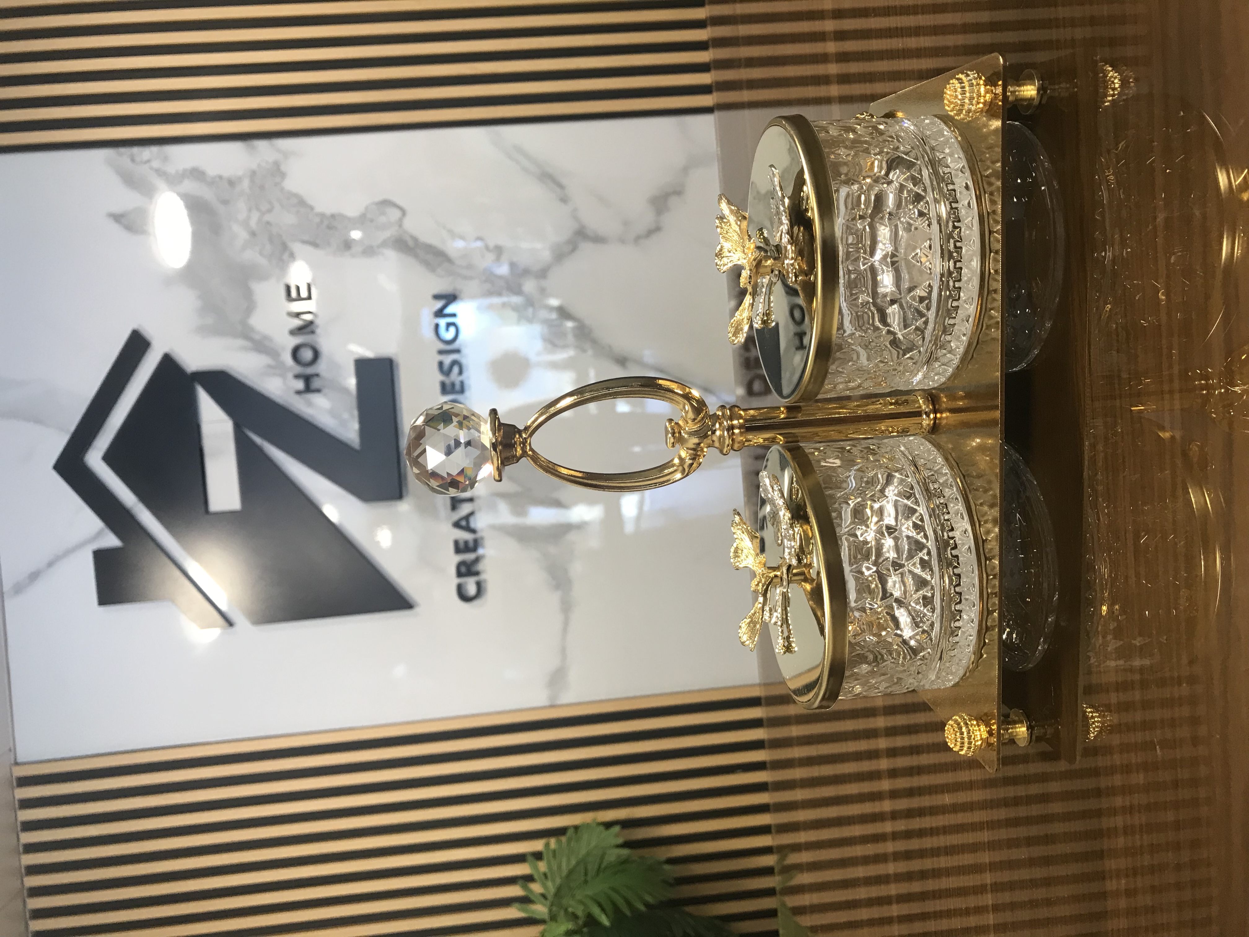 Luxury 2 crystal candy jars with golden lids and floral accents on a decorative gold tray