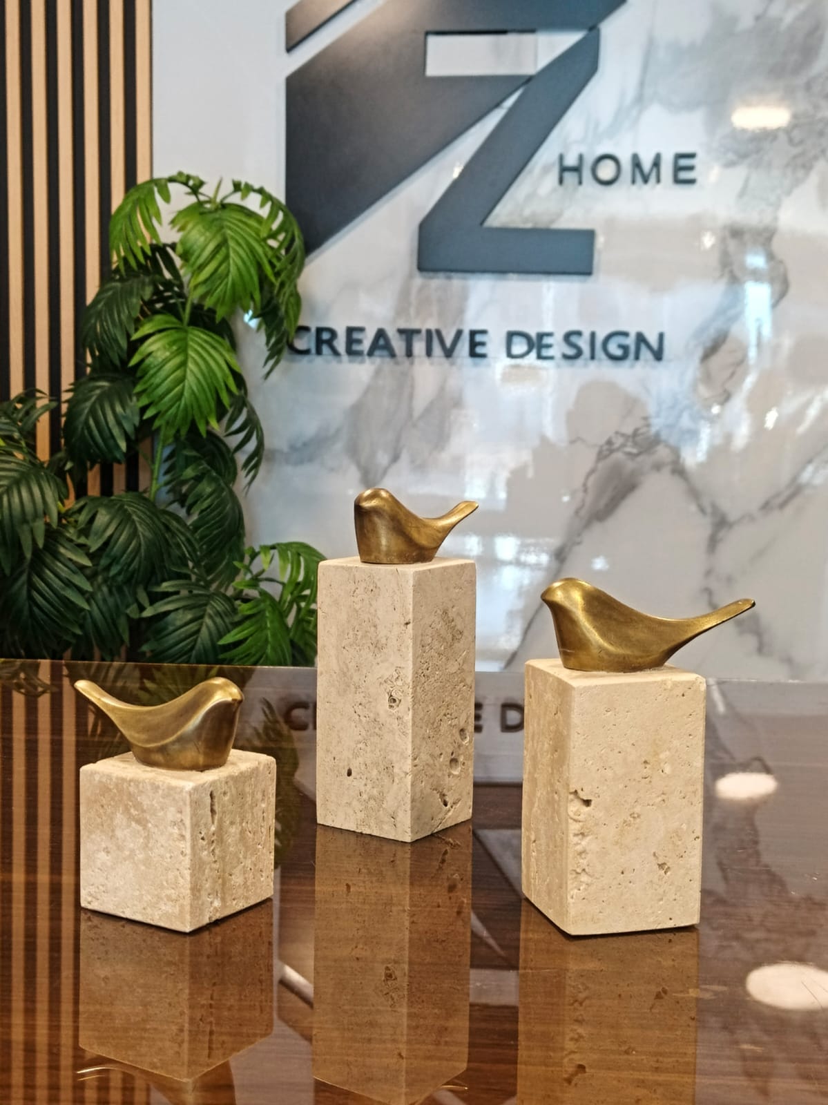 set of 3 birds bronze on base travertine