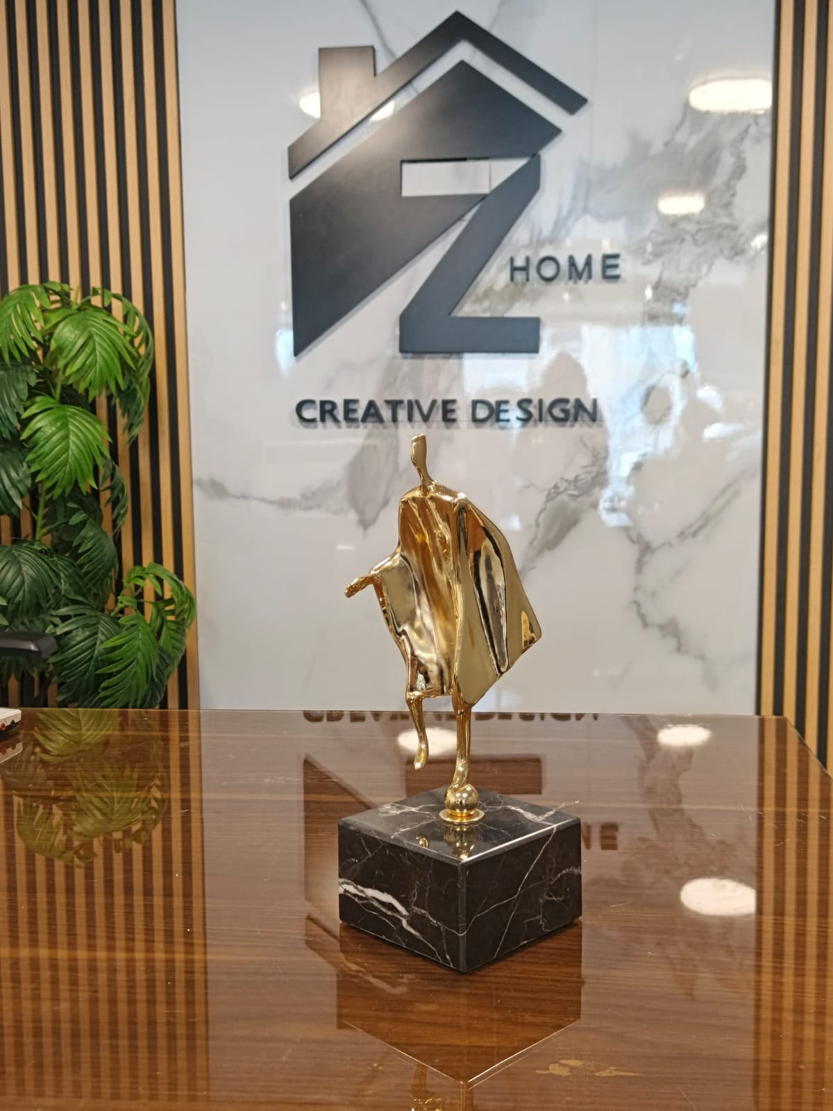 man gold on black marble